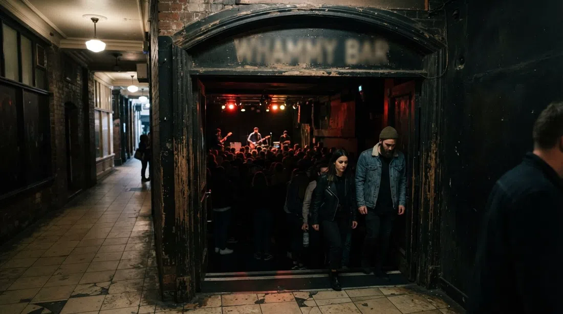 Whammy Bar in St Kevin’s Arcade, low basement stage lighting, dark crowd, and the arcade’s narrow entryway hinting at the underground room