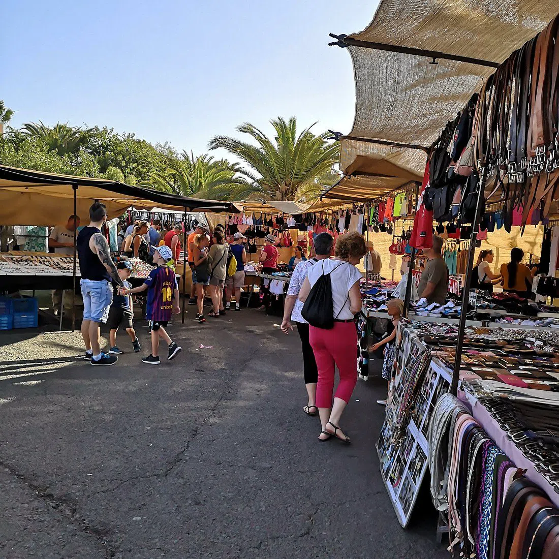 Tuesday market stalls along the Arguineguín seafront promenade