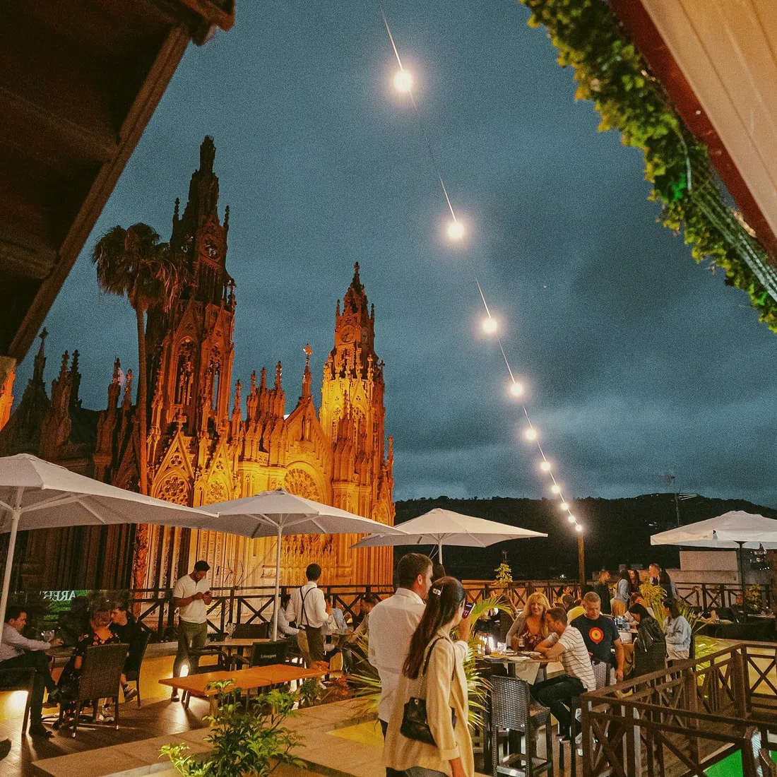 sunset drinks on Emblemática Rooftop overlooking the church in Arucas