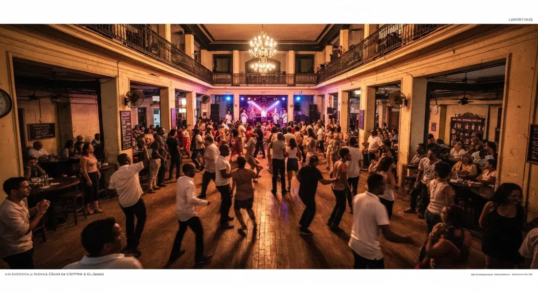 the packed dance floor inside Casa de la Música de Centro Habana on Galiano, dancers in motion under warm stage lights during a live timba set