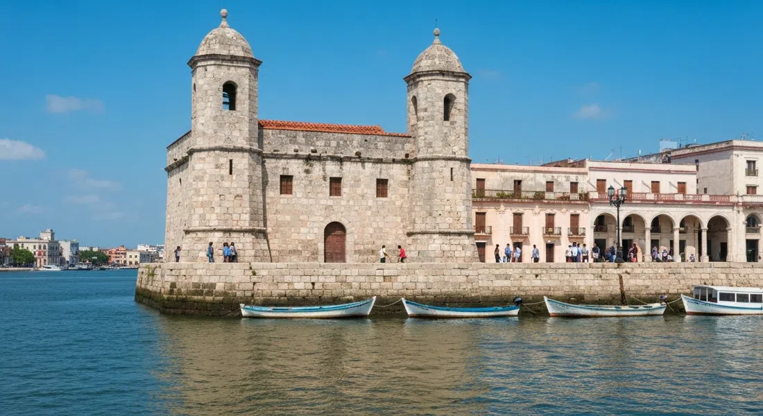 the squat 1649 Torreón de Cojímar at the river mouth, weathered stone above the harbour skiffs and low water