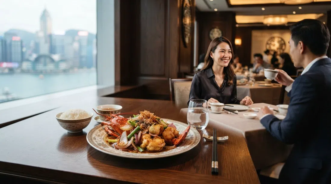 a refined Cantonese lobster dish at T'ang Court, glossy stir-fried shellfish with three kinds of onion plated in a polished fine-dining room