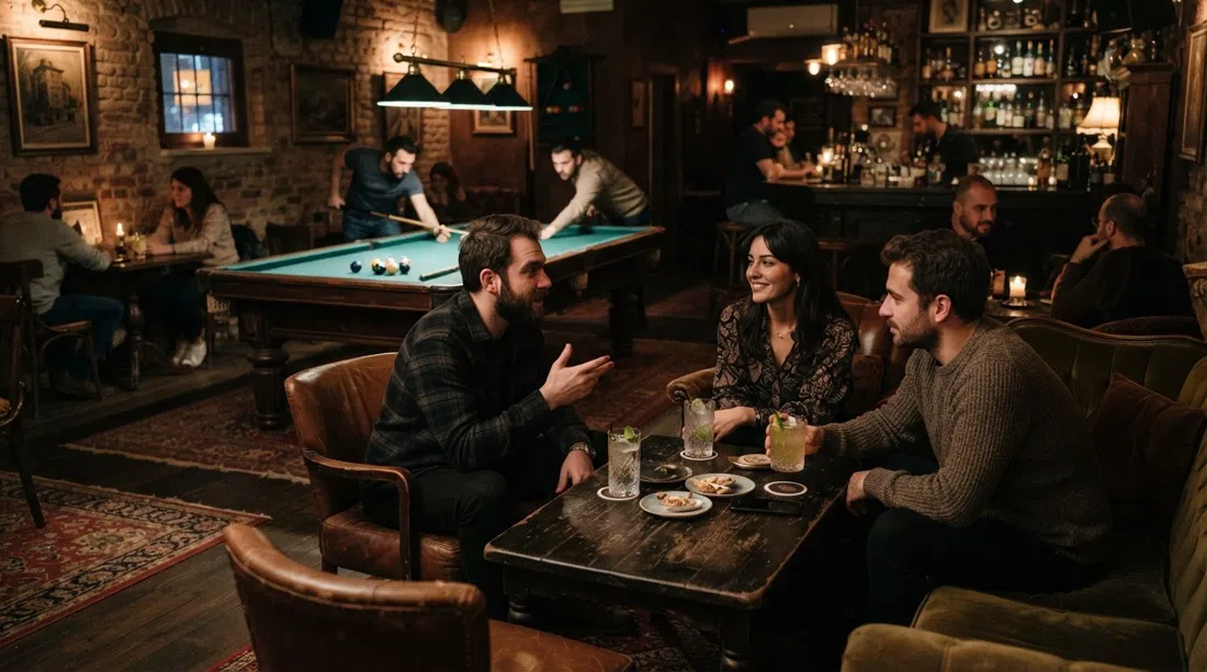 Karloff in Topağacı, low-lit speakeasy interior with antique furniture, plush seating, a billiards table and cocktail glasses