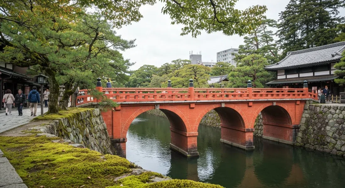 Nanzen-ji’s red-brick Suirokaku aqueduct carrying the Lake Biwa Canal through temple grounds, seen from below with moss and stone in the foreground