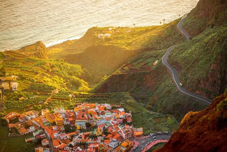 Agulo's whitewashed houses and red-tiled roofs on their volcanic shelf, banana terraces falling away to the Atlantic below
