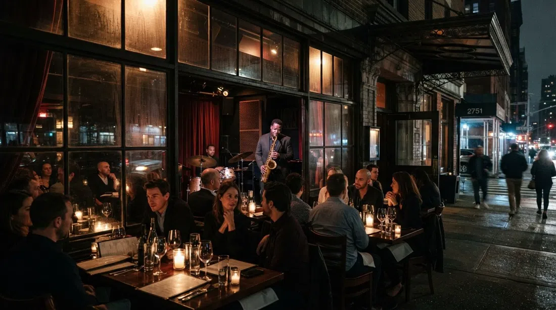 Smoke Jazz & Supper Club on Broadway at night, candlelit tables glowing through the window with a saxophonist onstage