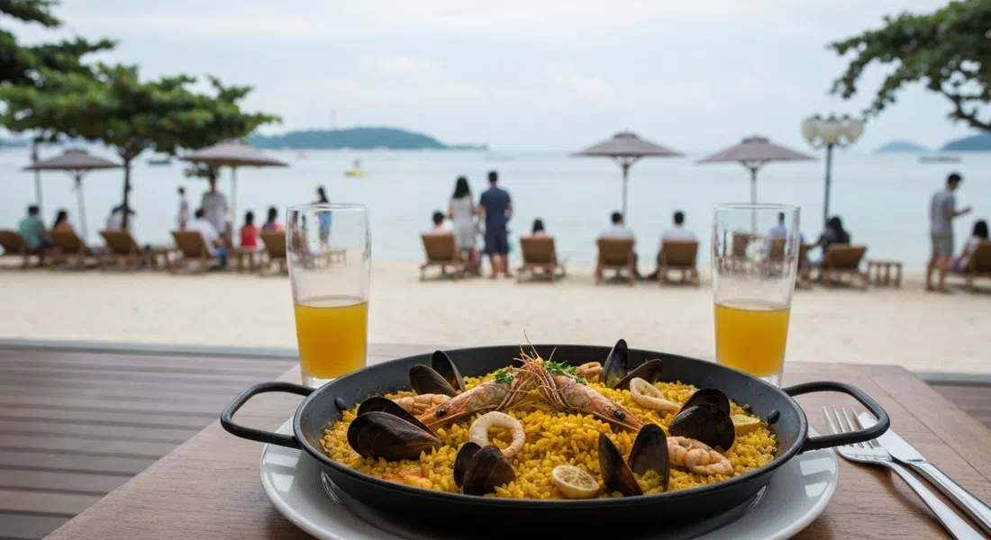 a sharing paella at FOC By The Beach on Palawan Beach, saffron rice and seafood served beachside with the sea in the background