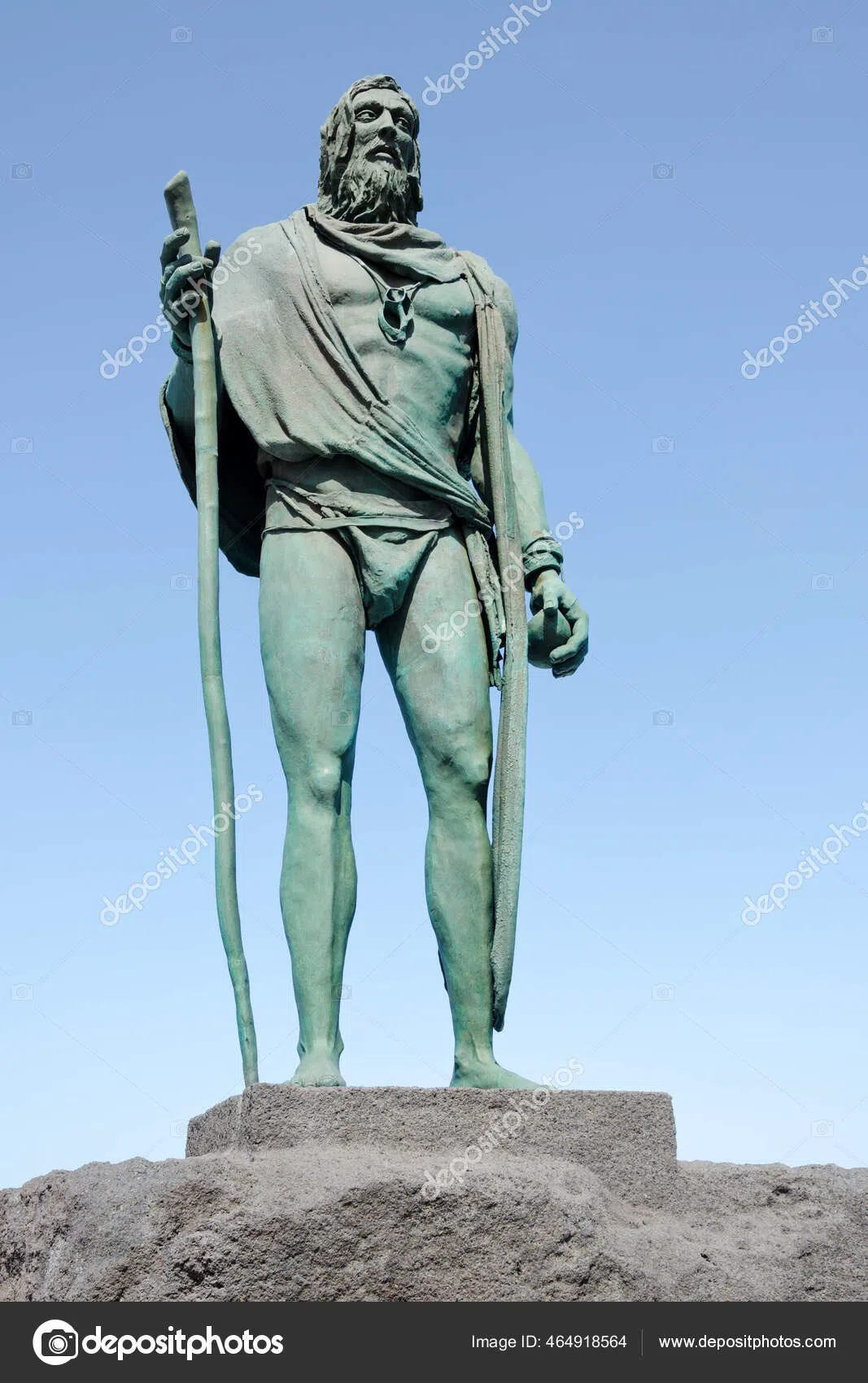 the nine bronze Guanche mencey statues standing in a row on Plaza de la Patrona de Canarias in Candelaria