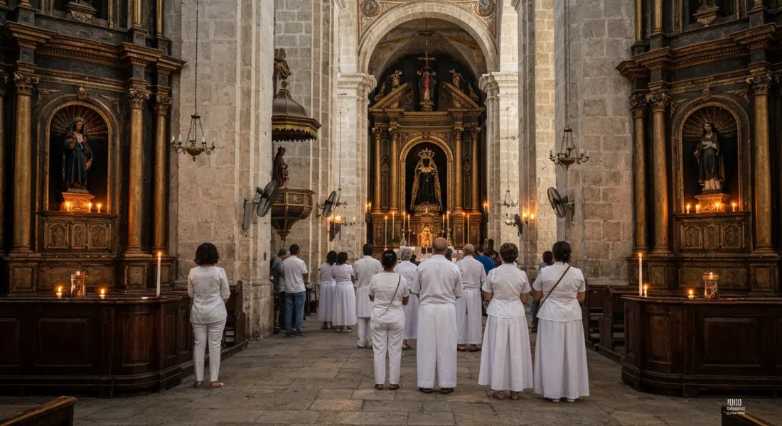 the interior of Iglesia de Nuestra Señora de Regla, candle glow, prayerful visitors in white, and the dark alcoves around the Black Madonna