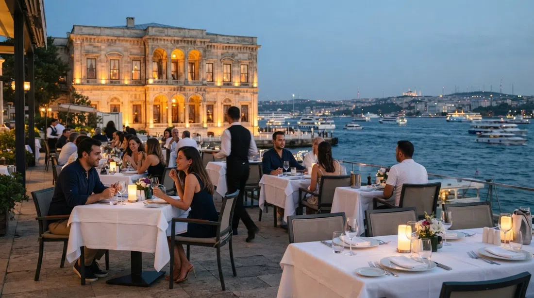 Lokanta Feriye terrace on the Bosphorus in warm evening light, white tablecloths and the water visible beyond the restored palace