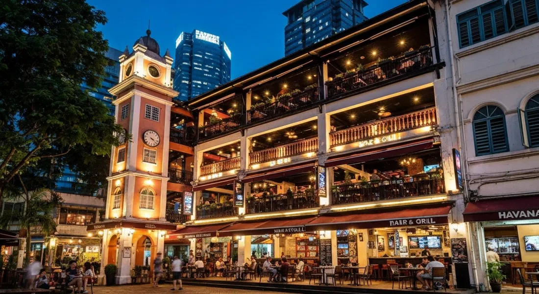 Havana Bar & Grill on Changkat Bukit Bintang at night, three levels lit in warm neon with courtyard tables below