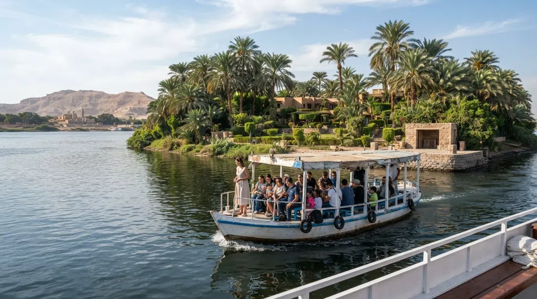 the Jolie Ville ferry approaching Kings Island in the Nile, palms and resort gardens visible on the private 150-acre island under bright Luxor sun