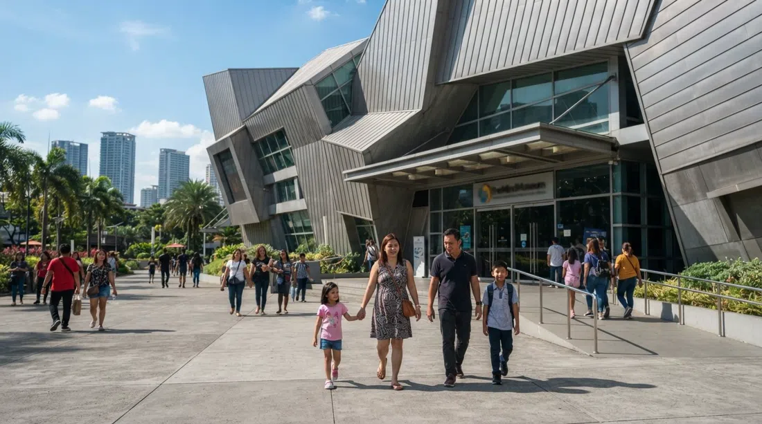 The Mind Museum’s exterior in BGC with families approaching the entrance, bright daylight and the museum’s modern facade in frame
